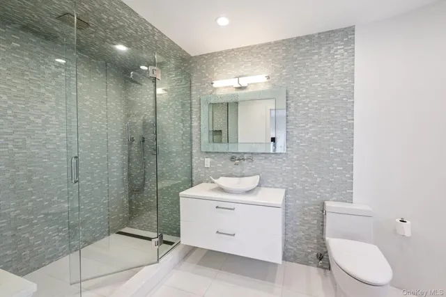 a bedroom with a bed and cupboard