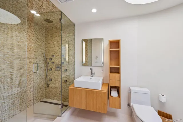 a bedroom with a large bed and a large window