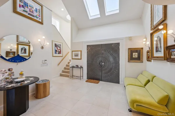 a living room with furniture flowerpot and a table