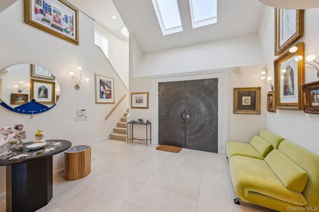 a living room with furniture flowerpot and a table