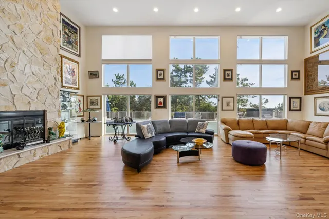 a living room with furniture fireplace and flat screen tv