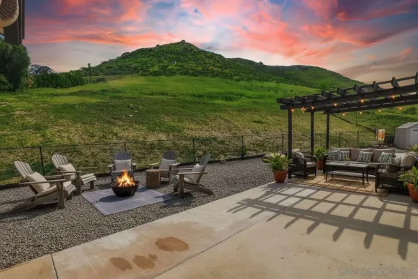 a view of a terrace with furniture and garden