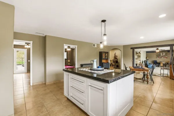 a view of living room kitchen and dining area