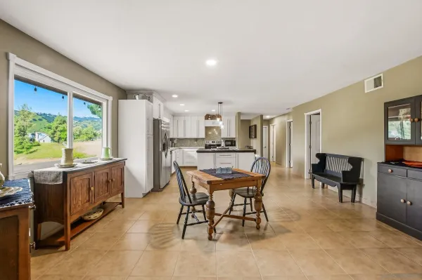 a view of a dining room with furniture window and outside view