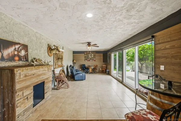 a view of a livingroom with furniture and a fireplace