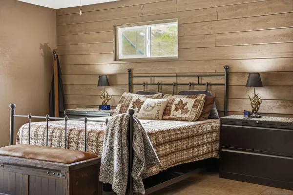 a bedroom with a bed and a dresser