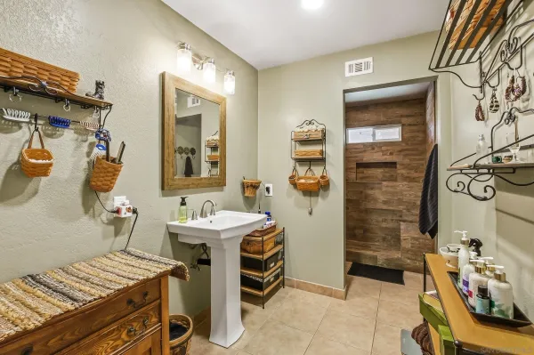 a bedroom with a bed and a table