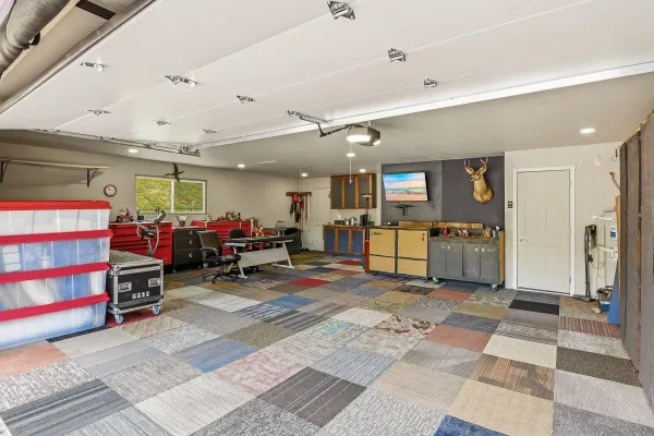a view of a livingroom with furniture and a gym
