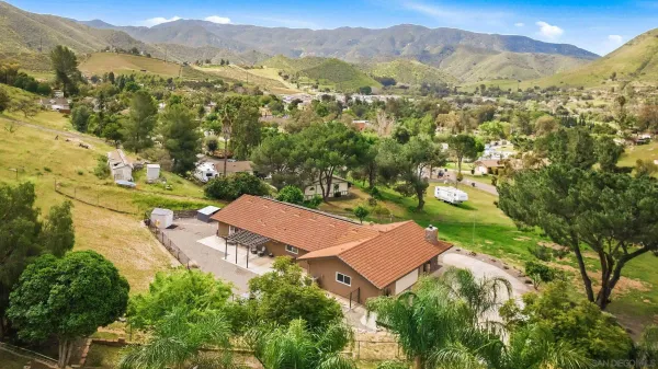 a view of a city with mountains in the background