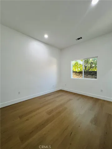 an empty room with a empty space and window