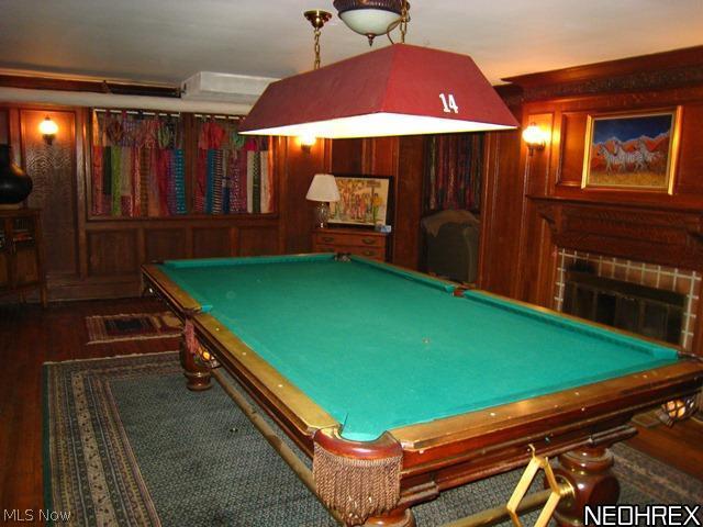 2944 Winthrop Road Cleveland, OH 44120 - Photo 22 of 25 Lower Level oak paneled rec room with wood floors, fireplace and additional TV room.
