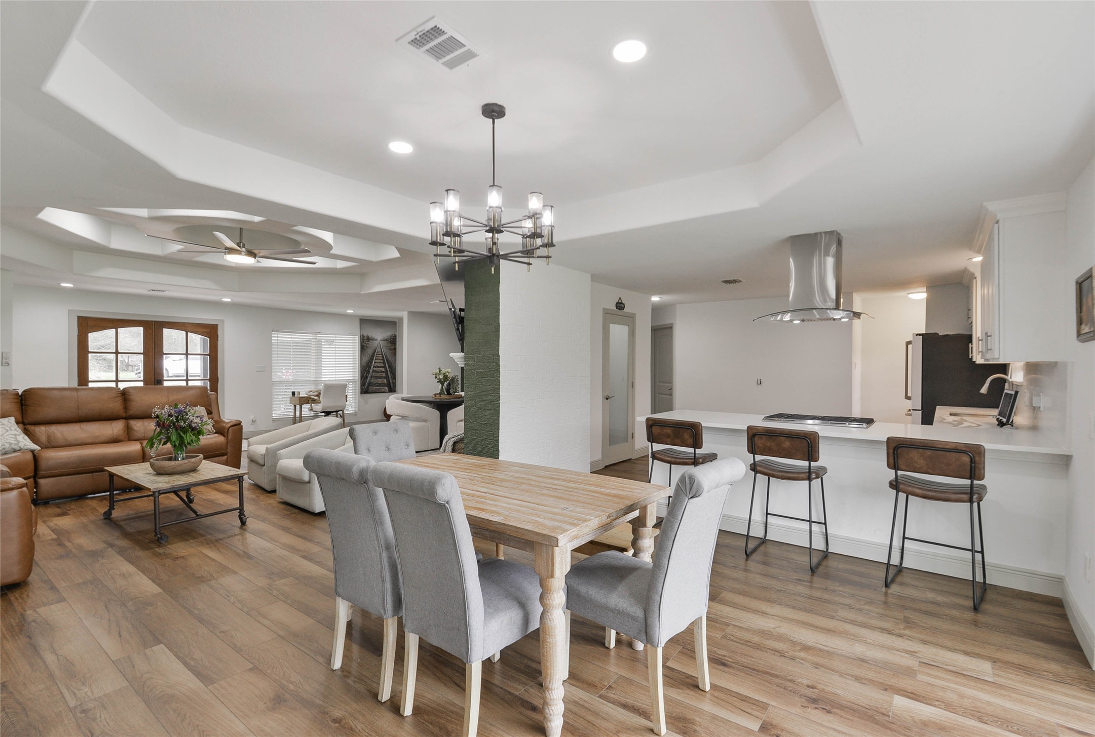 531 Brandon Road Conroe, TX 77302 - Photo 25 of 33 a view of a dining room with furniture and wooden floor