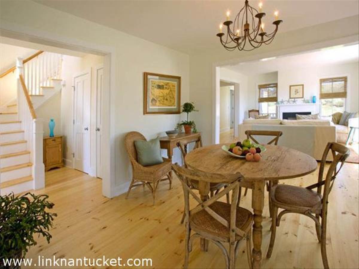 13 Wood Lily Road Nantucket, MA 02554 - Photo 5 of 8 a view of a dining room with furniture and a chandelier