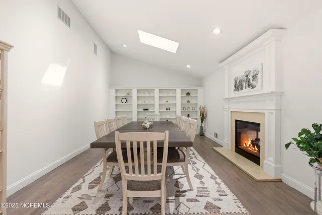 a view of a livingroom with furniture and a fireplace