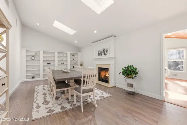 a living room with fireplace furniture and a flat screen tv