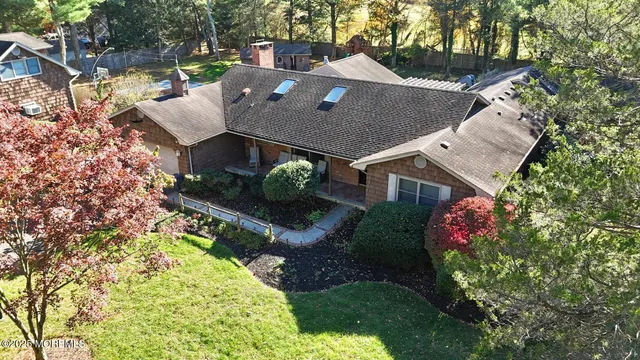 a aerial view of a house with a yard