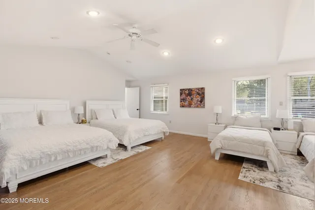 a spacious bathroom with a tub sink and mirror