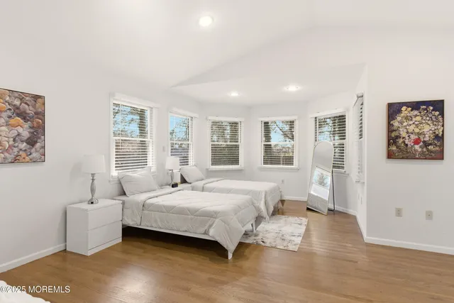a bathroom with a tub shower and a sink