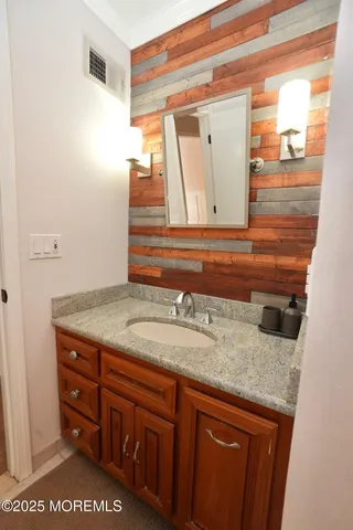 a view of balcony with couch and wooden floor