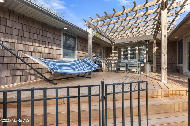 a view of a yard with wooden fence