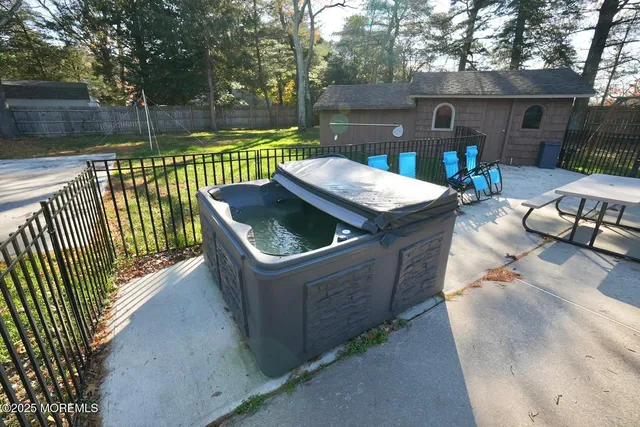 a front view of a house with a yard and lake view