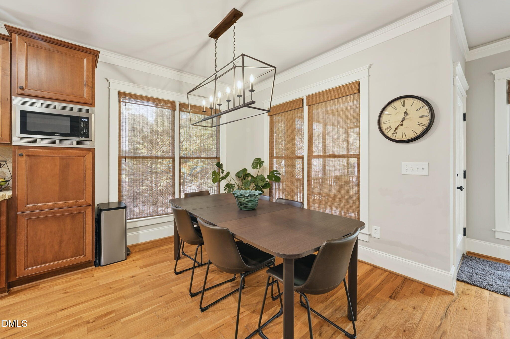 4305 Windscape Drive Apex, NC 27539 - Photo 14 of 50 a view of a dining room with furniture window and wooden floor