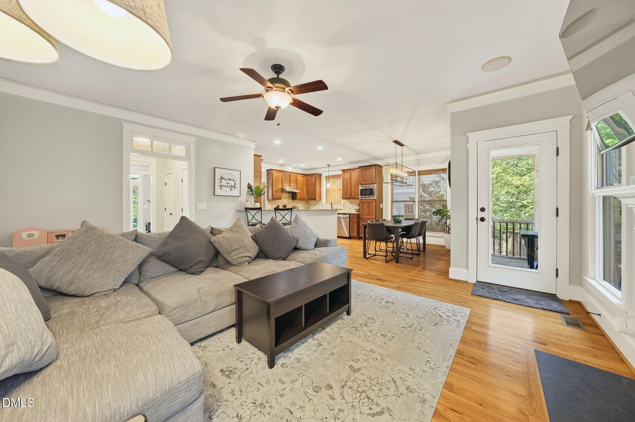 4305 Windscape Drive Apex, NC 27539 - Photo 19 of 50 a living room with furniture and a wooden floor