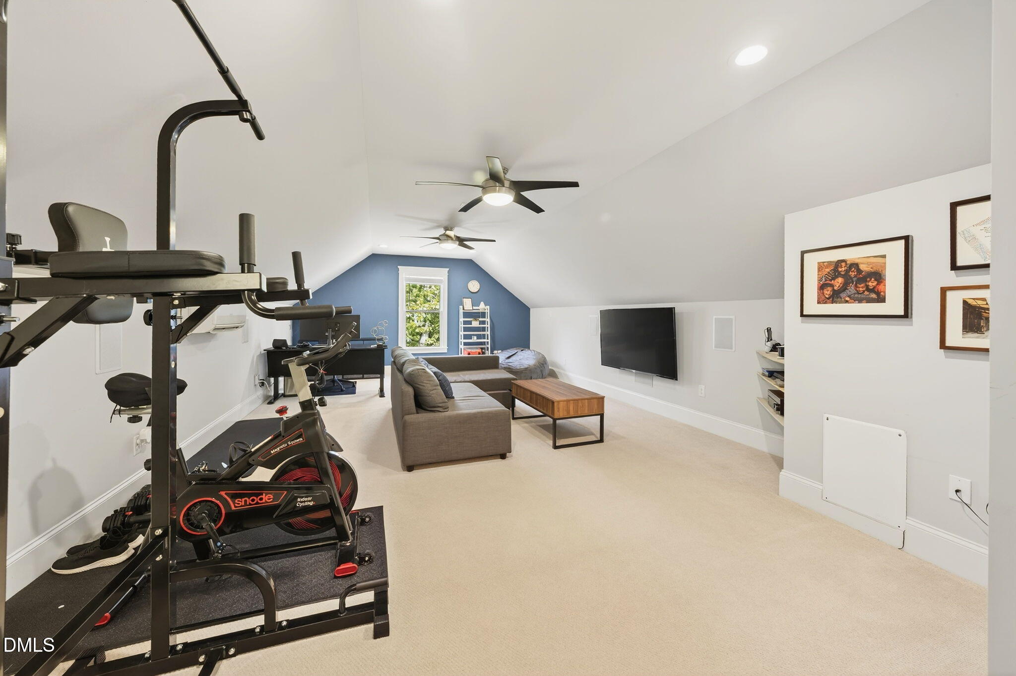 4305 Windscape Drive Apex, NC 27539 - Photo 25 of 50 a living room with furniture and a flat screen tv