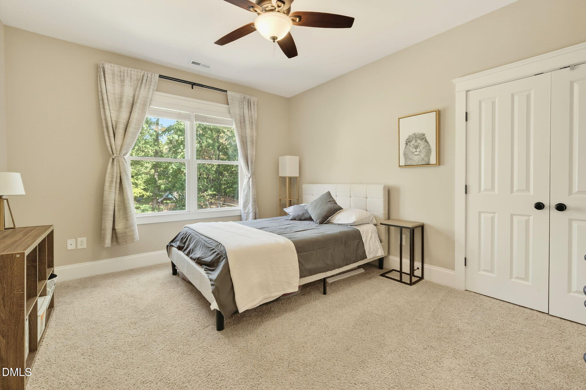 4305 Windscape Drive Apex, NC 27539 - Photo 27 of 50 a spacious bedroom with a bed and a window