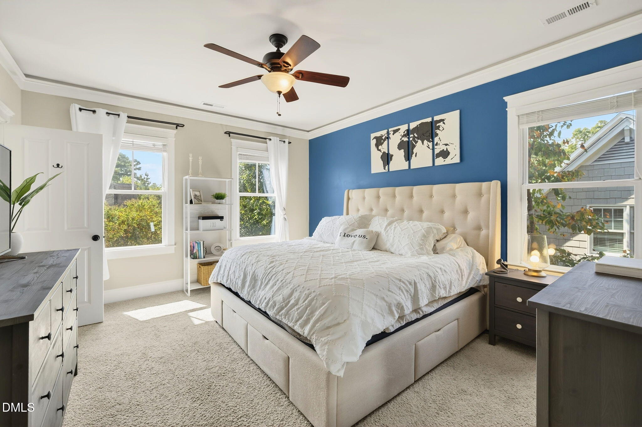 4305 Windscape Drive Apex, NC 27539 - Photo 3 of 50 a spacious bedroom with a large bed and a chandelier