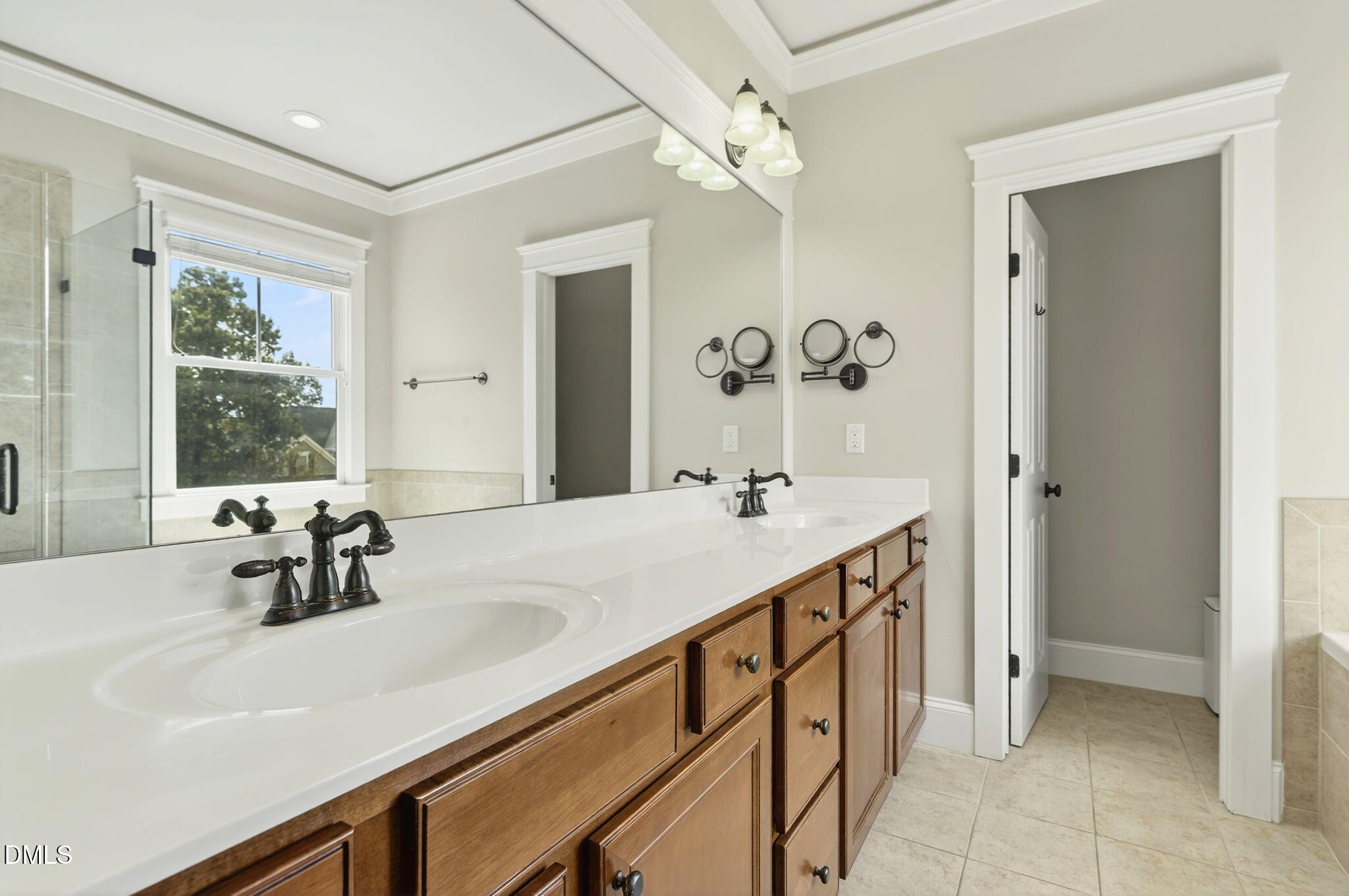 4305 Windscape Drive Apex, NC 27539 - Photo 32 of 50 a bathroom with a sink and a mirror