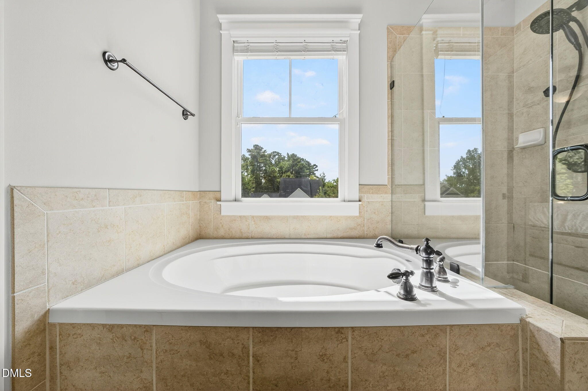 4305 Windscape Drive Apex, NC 27539 - Photo 34 of 50 a bathroom with a sink and a bathtub