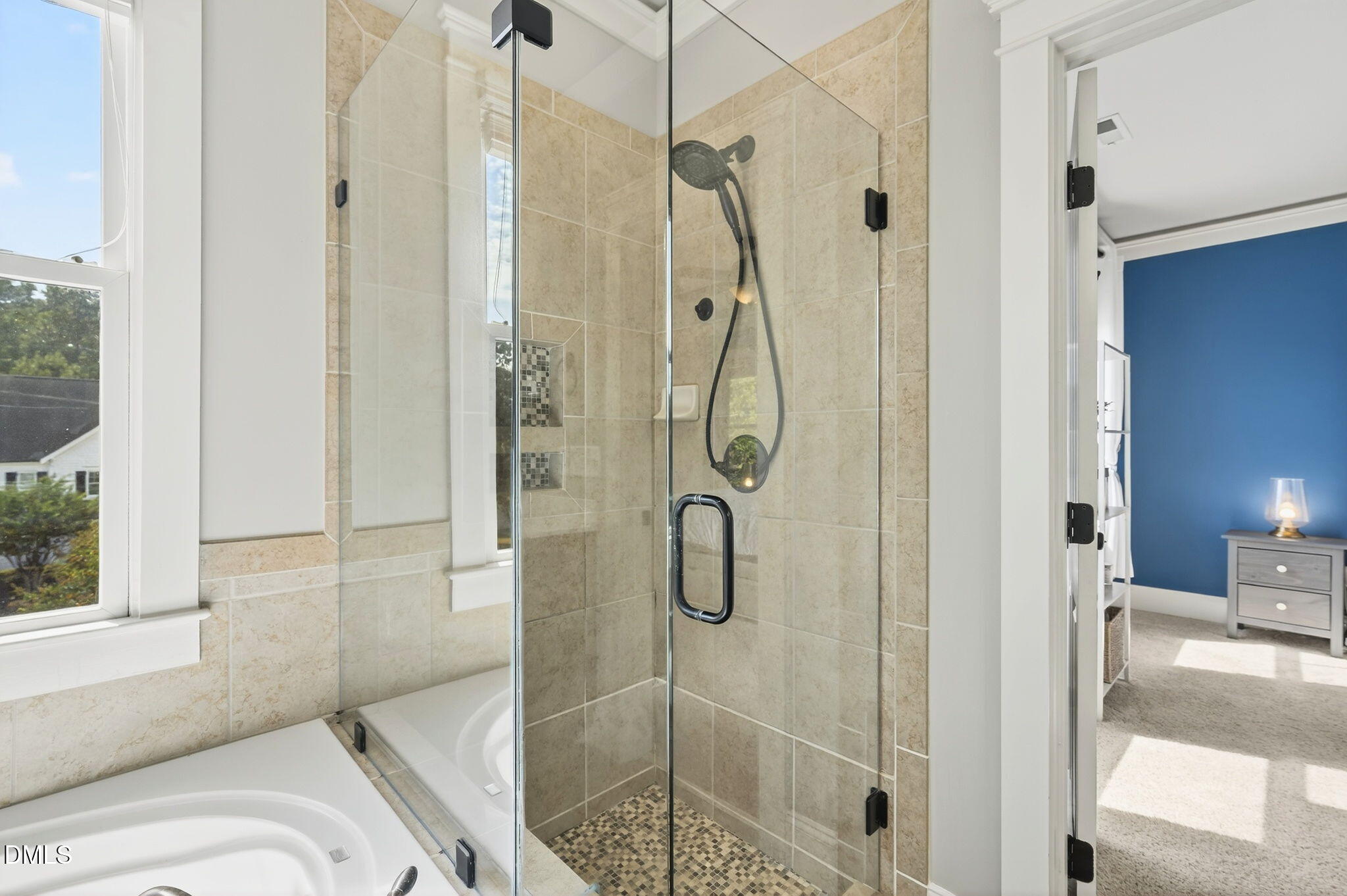 4305 Windscape Drive Apex, NC 27539 - Photo 35 of 50 a bathroom with a shower and a glass door shower