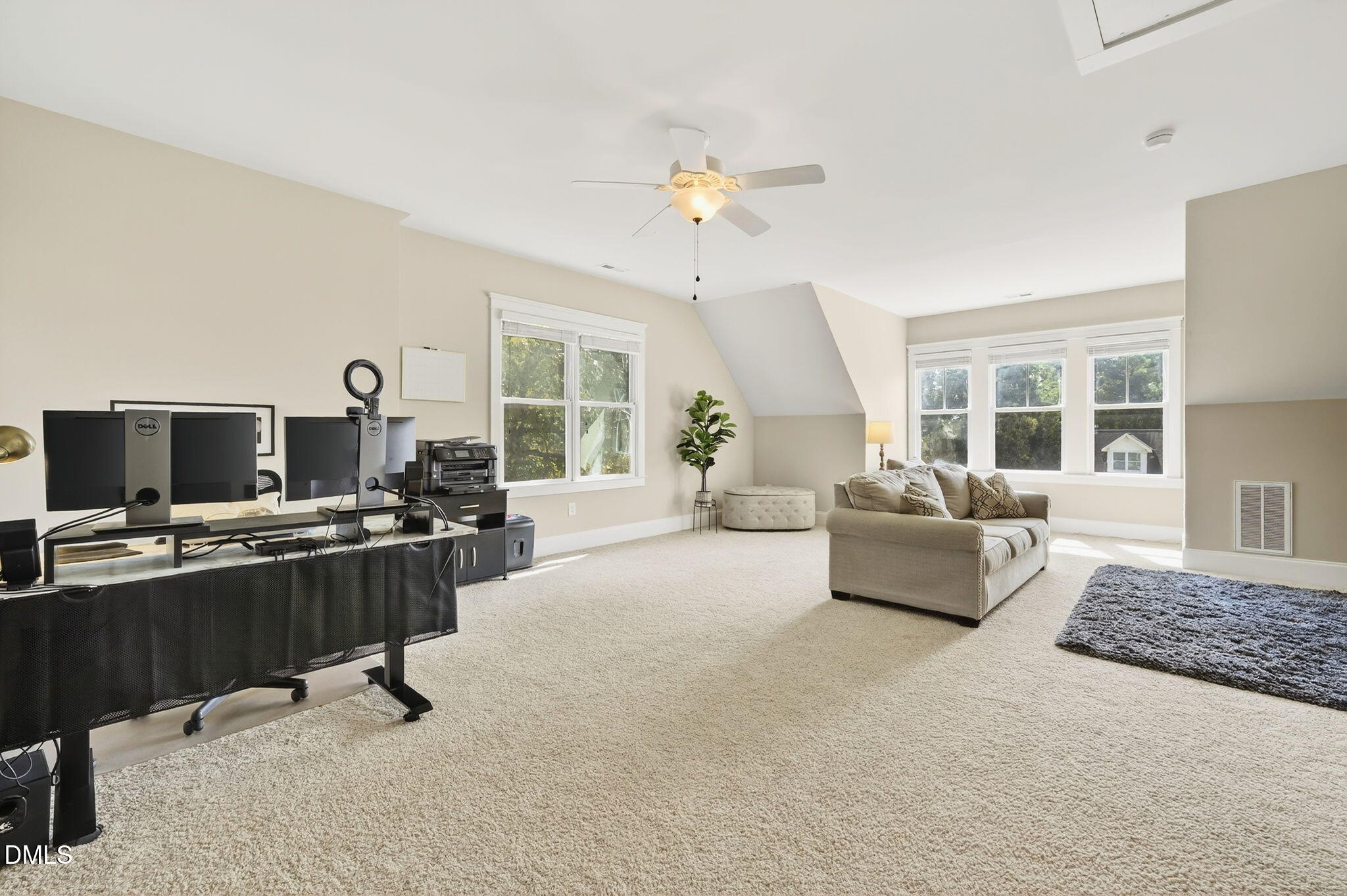 4305 Windscape Drive Apex, NC 27539 - Photo 4 of 50 a living room with furniture and a flat screen tv