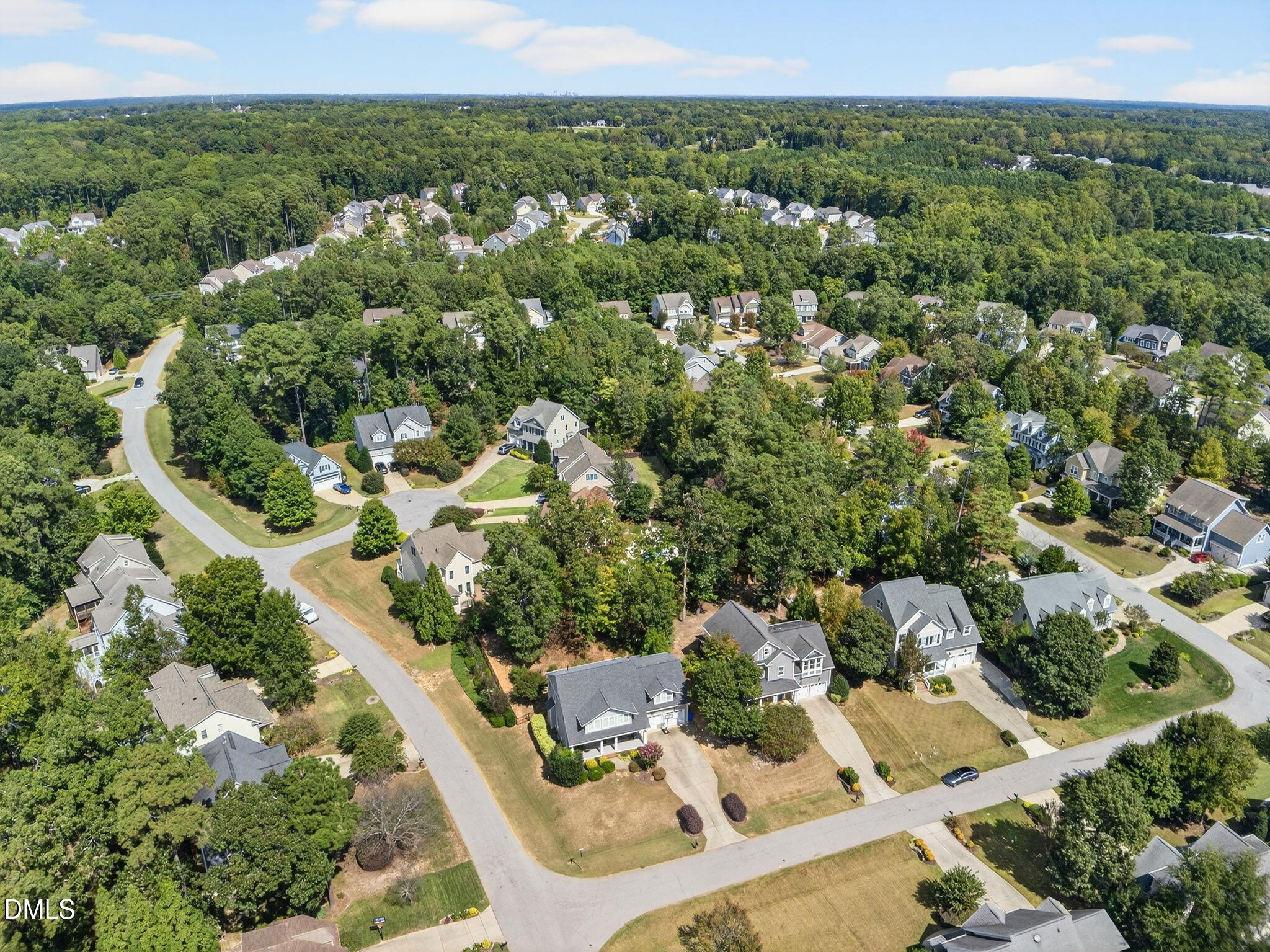 4305 Windscape Drive Apex, NC 27539 - Photo 47 of 50 an aerial view of residential houses with outdoor space and trees