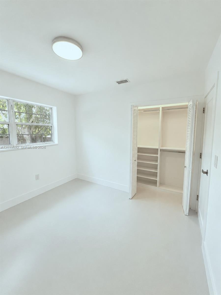 18935 Northwest 8th Avenue Miami Gardens, FL 33169 - Photo 13 of 26 a view of an empty room with a window