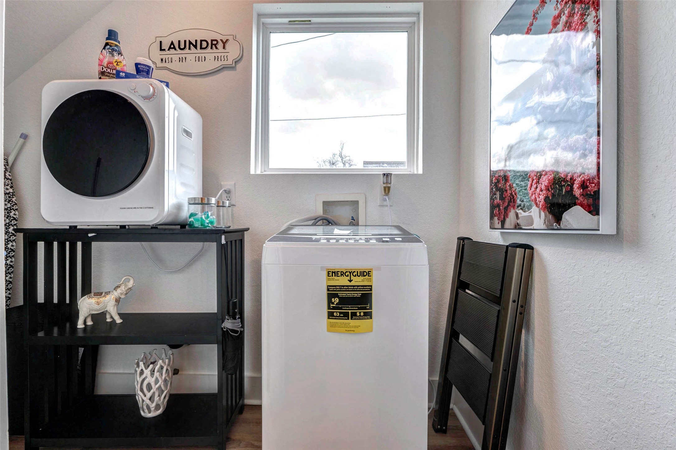 5407 Lee Street Houston, TX 77020 - Photo 13 of 17 This charming laundry nook, complete with a washer and dryer, offers convenience and style with its bright, airy ambiance and thoughtful decor.