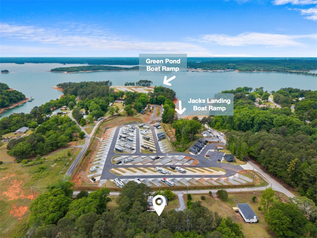 111 State Rd S-4-104 Anderson, SC 29626 - Photo 30 of 42 This expansive aerial view showcases a vibrant community nestled by a serene lake with convenient boat access.