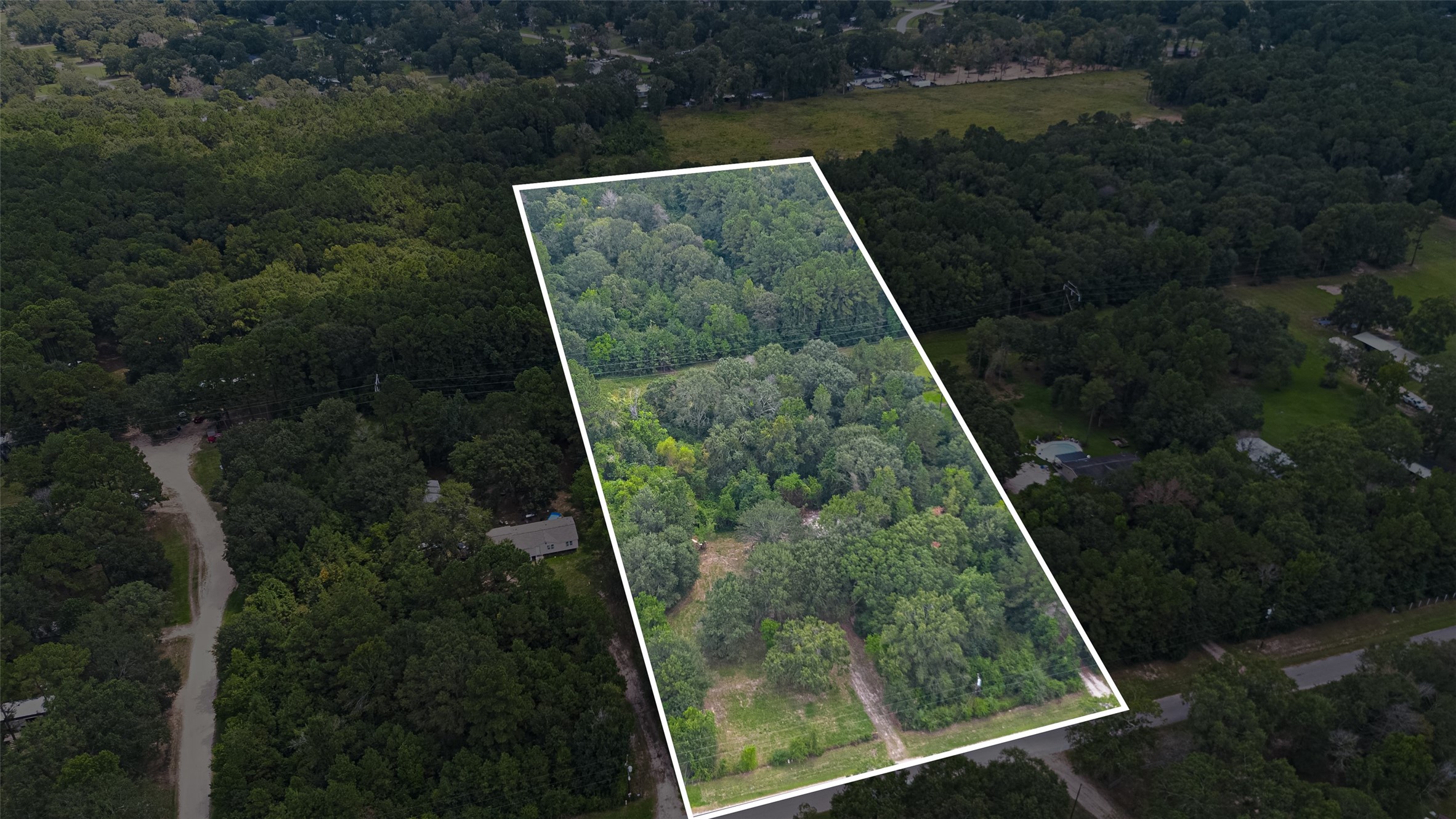 12297 Rebel Road Cleveland, TX 77327 - Photo 11 of 36 a view of a small yard from a balcony