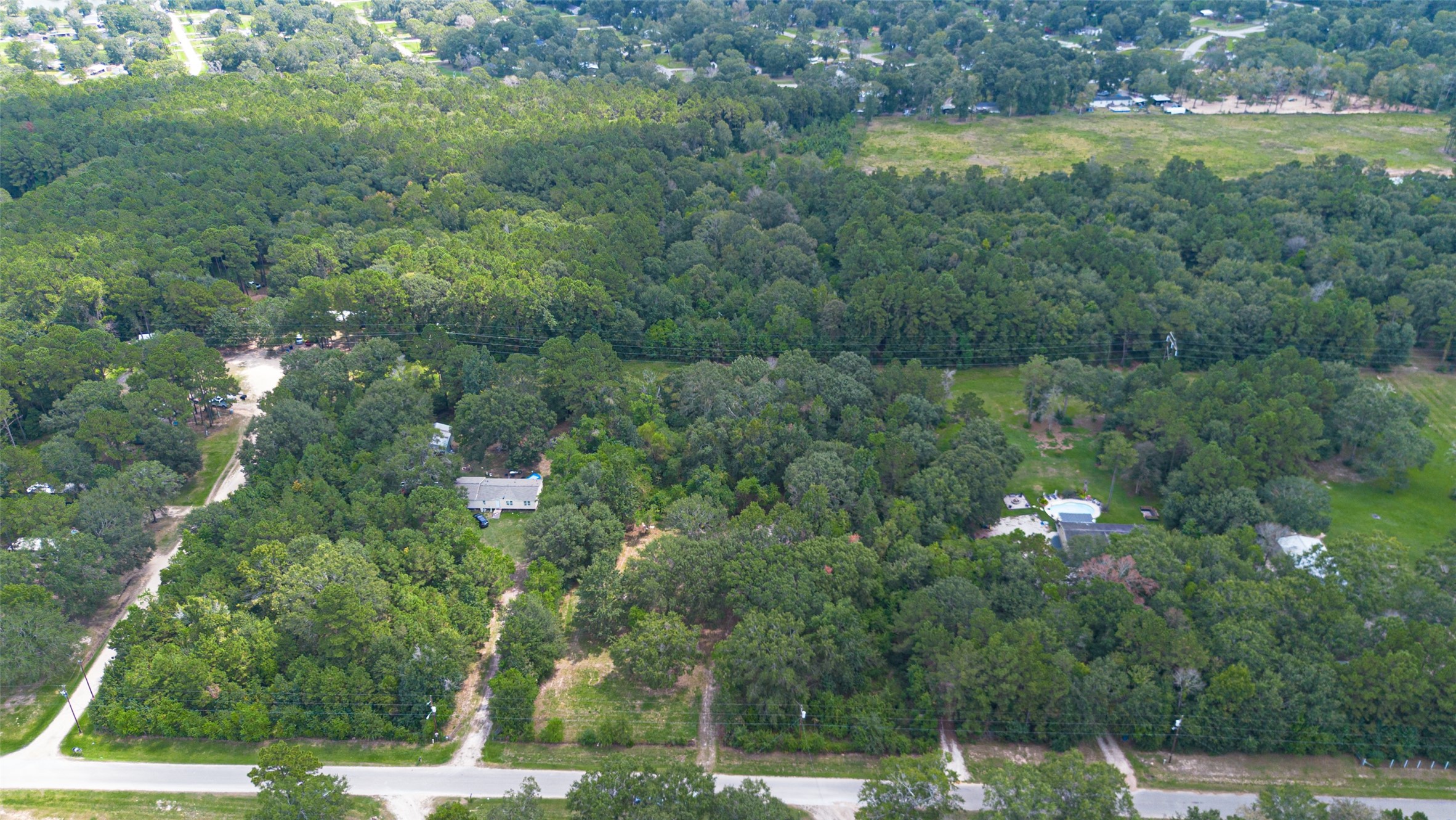 12297 Rebel Road Cleveland, TX 77327 - Photo 21 of 36 a view of a lake with a yard