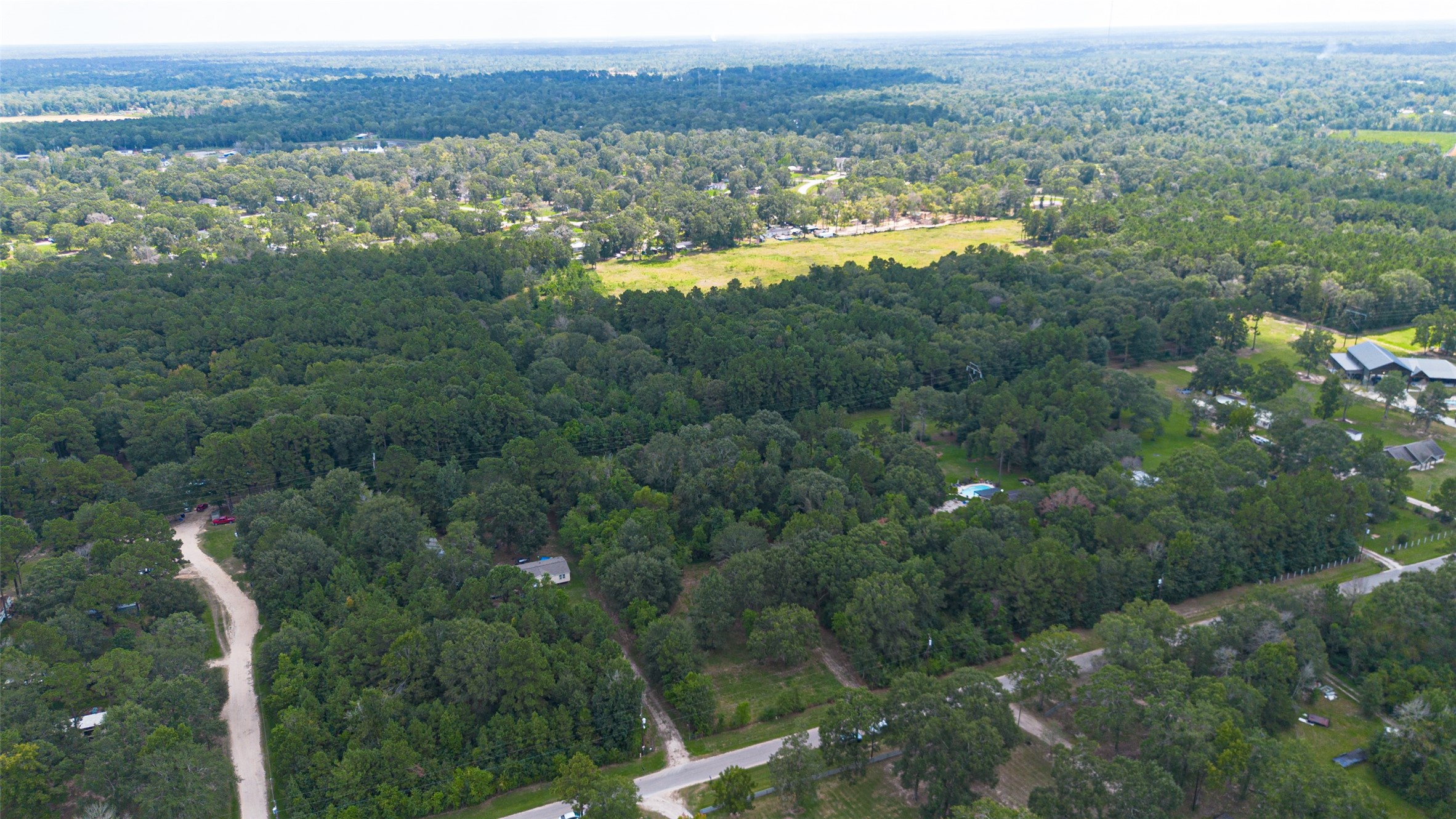 12297 Rebel Road Cleveland, TX 77327 - Photo 29 of 36 a view of a lake with a city view