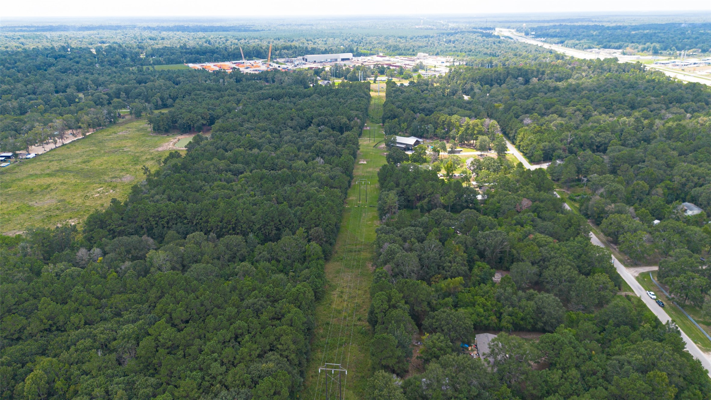 12297 Rebel Road Cleveland, TX 77327 - Photo 36 of 36 an aerial view of residential houses with outdoor space and trees