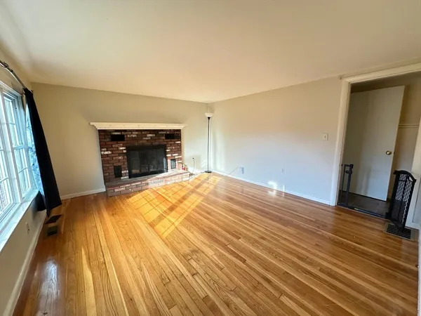 a bedroom with a bed and a fireplace