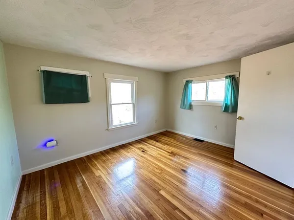 a view of livingroom with hardwood floor and window