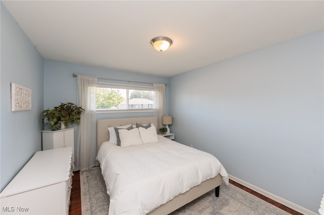 7316 Oakwood Road Parma, OH 44130 - Photo 12 of 41 Bedroom with dark wood finished floors and baseboards