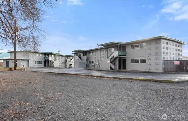 a view of a terrace with chairs and a fireplace