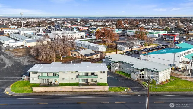 a view of backyard with swimming pool