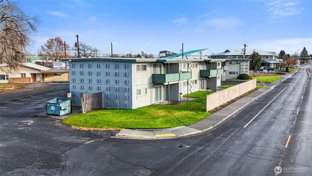a kitchen with stainless steel appliances white cabinets and a sink