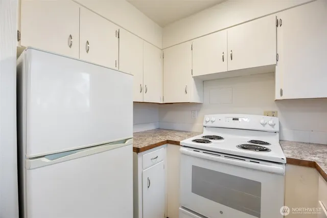 a view of kitchen with wooden floor