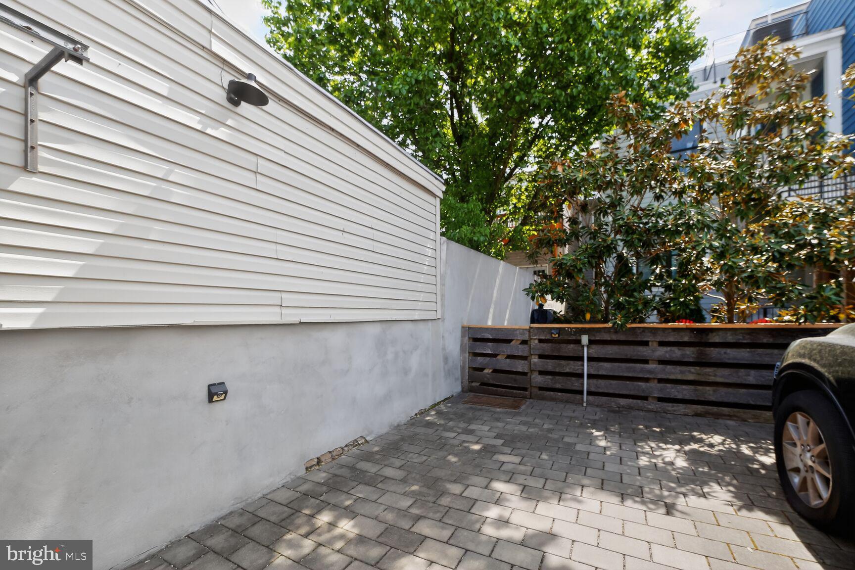 1232 I Street Northeast, Unit 1 Washington, DC 20002 - Photo 53 of 59 Charming outdoor space with greenery.